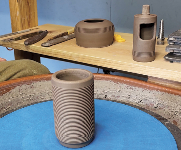 10 Trim the bottom of the second thrown cylinder. This ledge will be the flange of a lid and lock in place on top of the base form.