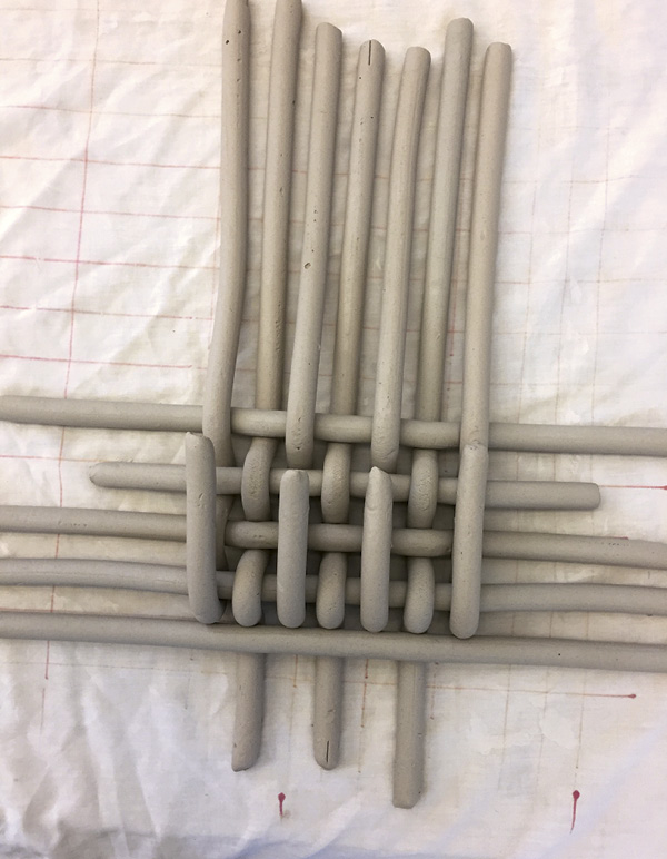 3 Continue folding back and weaving until you come to the end of the vertical coils.