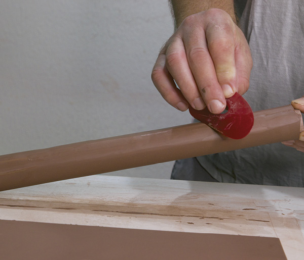 2 Slip, score, and join the beveled edges. Compress the seam with a soft rib.