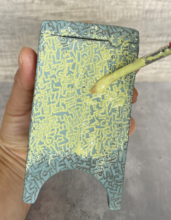 11 Apply a coat of a complementary underglaze color.