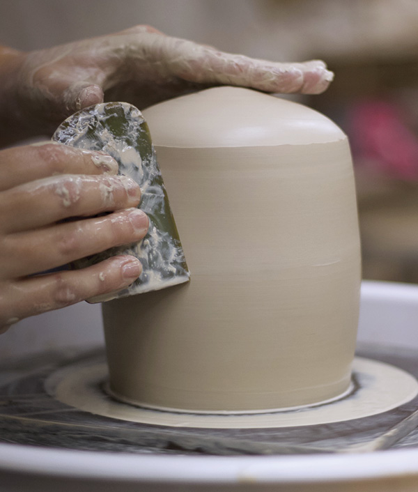 2 Throw a hollow form with thick walls, using a rib to shape the piece and add the top angle of the lid.