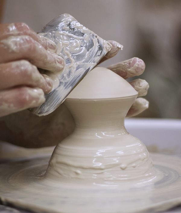 3 Throw several hollow-form knobs. Refine each one and choose the best for each lid and vessel.