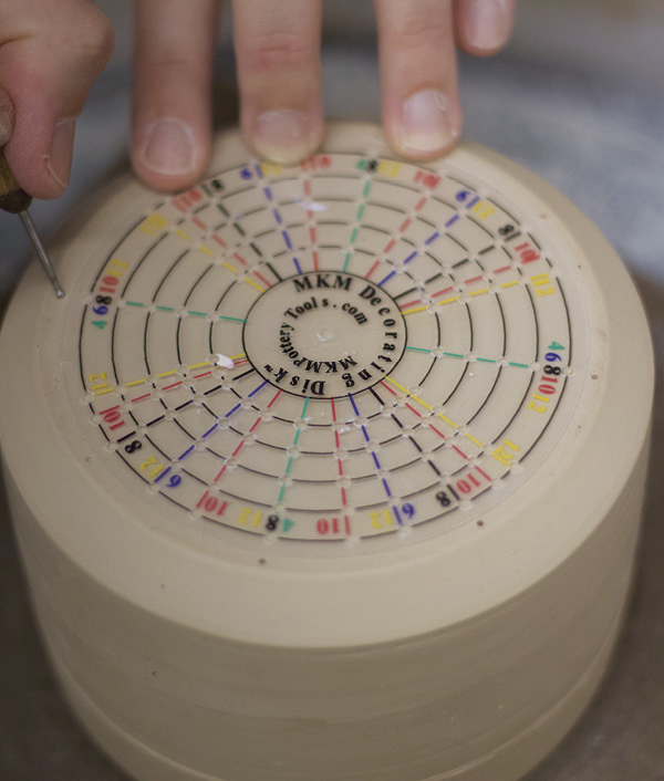 7 Divide and mark the base of the piece into equal sections using an MKM decorating disk.