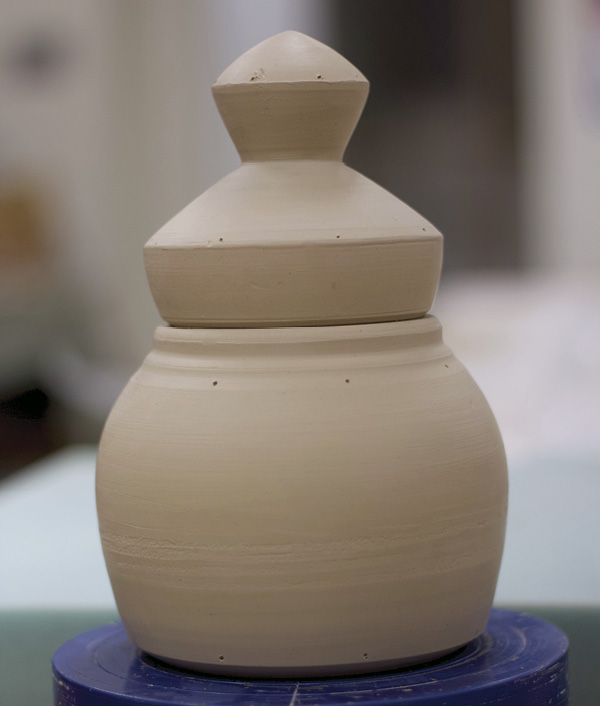 8 Make small marks on the lid and the finial at the same intervals as you marked the base.
