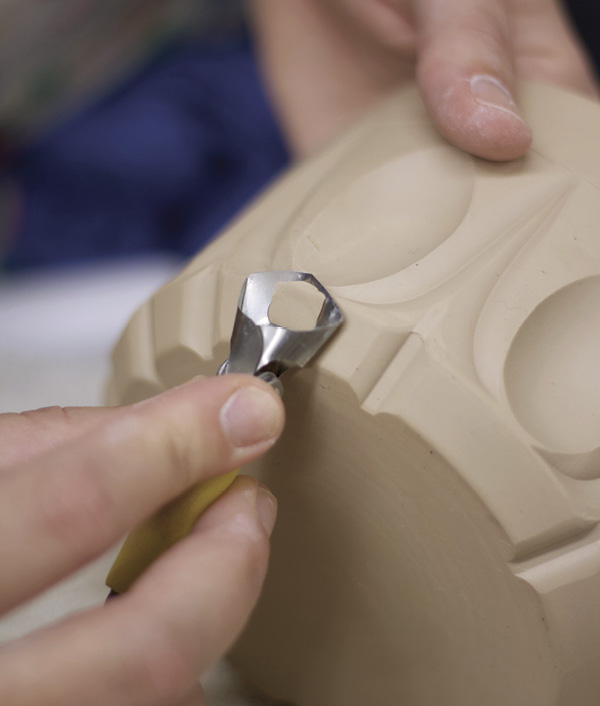 11 Continue the process of choosing a new tool, carving a mark, and repeating in each section as you rotate the form.