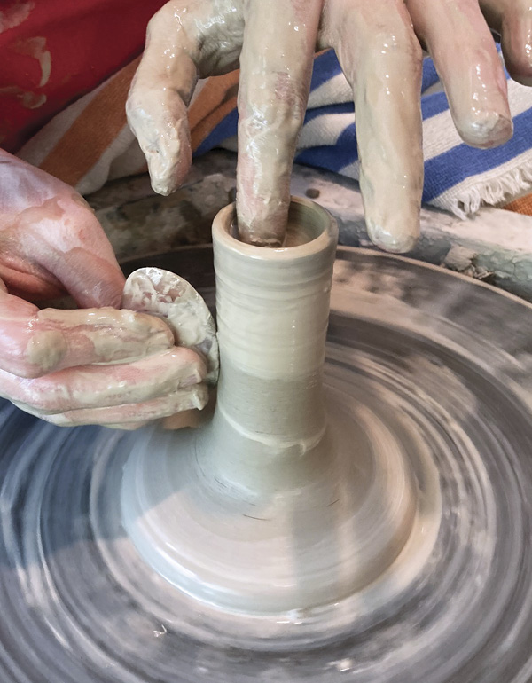 1 Throw a straight-sided cylinder with a flared foot.