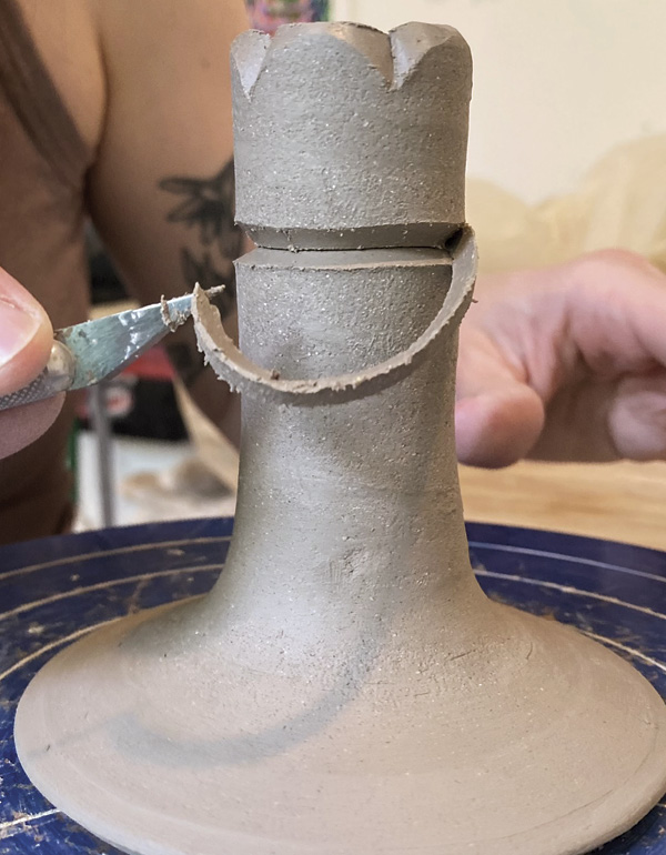 5 Remove this piece of clay to define the area of the pot that will hold the candle.
