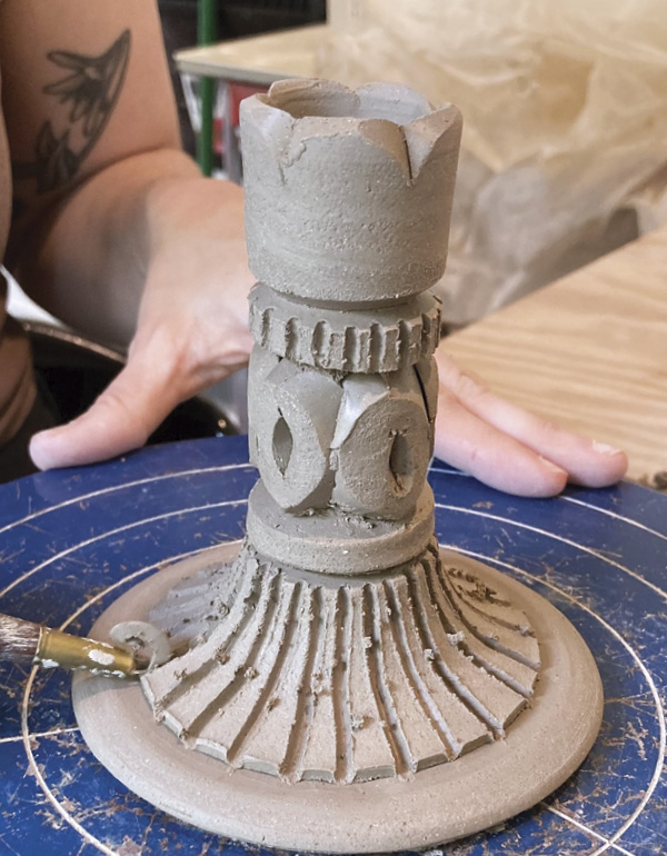 7 After cutting out the pattern, make finer lines and add detail with a sgraffito tool.
