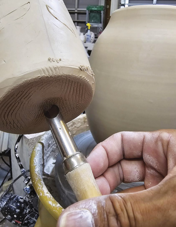 5 Before removing from the cuts, score the bottom of the piece going inside.