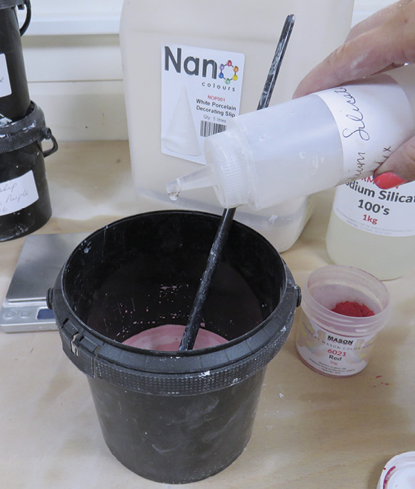 3 Pour sodium silicate/water mixture into the colored slip, drop-by-drop until it is the consistency of milk.