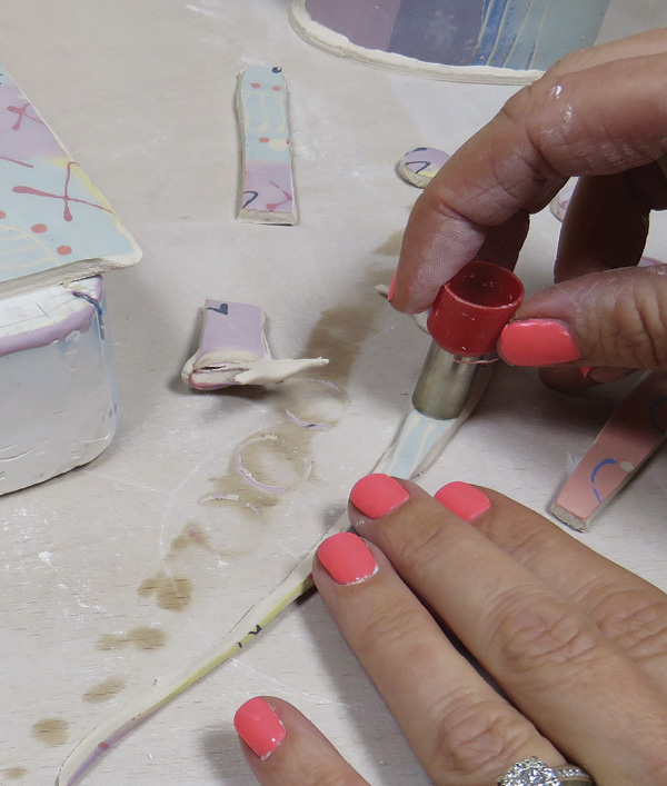 16 Using a small circle cutter, cut buttons out of the trimmings. Keep them to add to vessels or to make earrings.