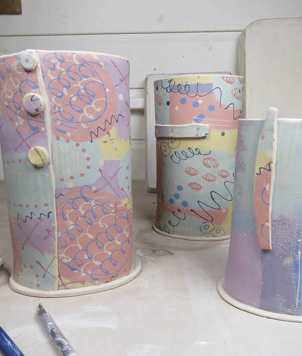 18 Leather-hard vessels. Colors get paler after drying and bisque firing. They pop after being glaze fired and sealed.