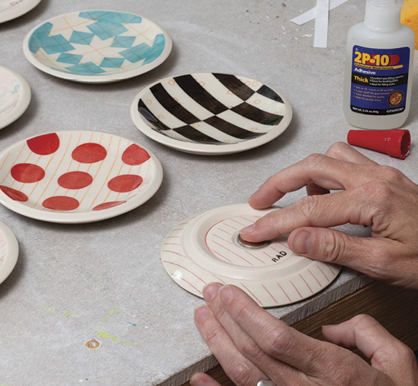 7 After the final firing, glue the magnet into place.