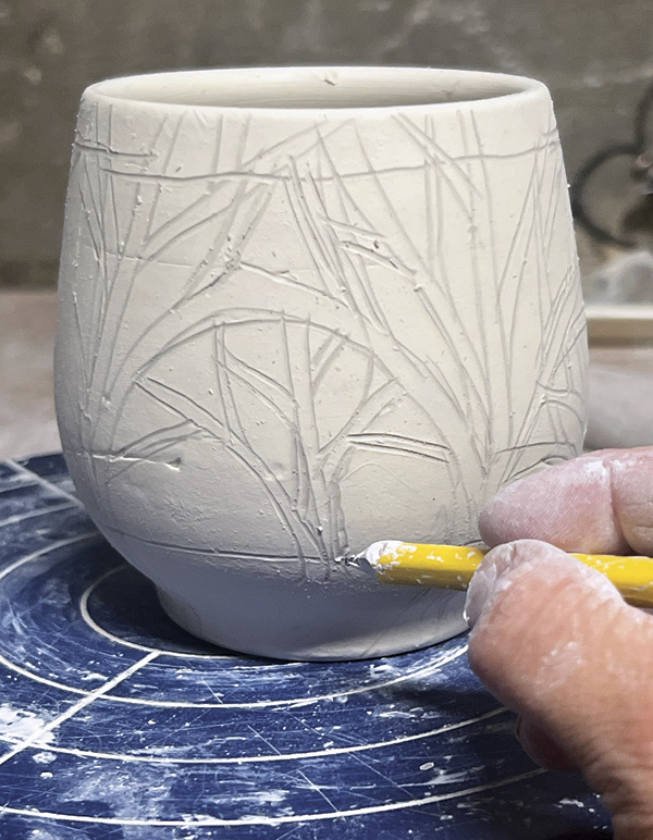 4 Mark bands at top and bottom of vessel to contain the design.