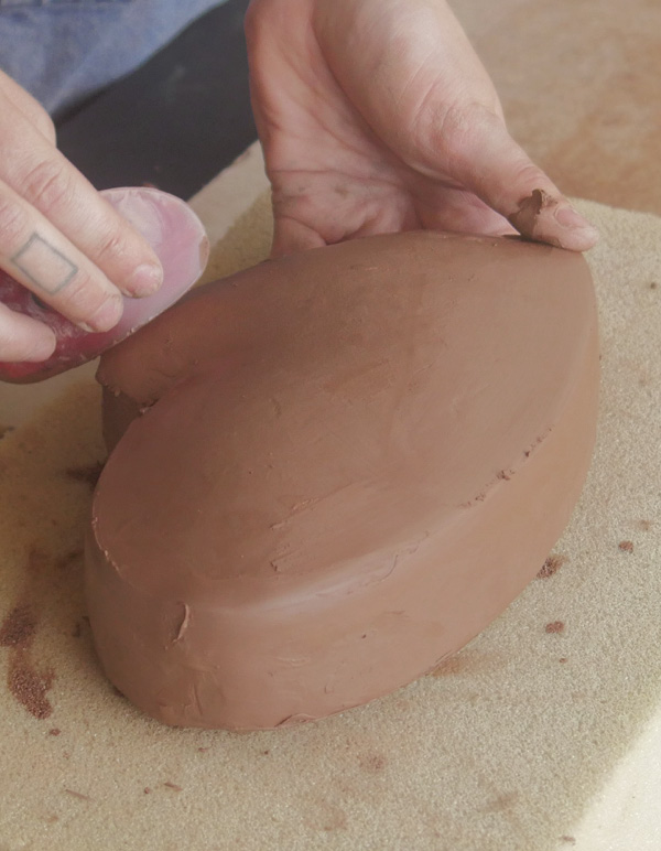 7 Flood the seams with water, then compress the seams with a red polymer rib.