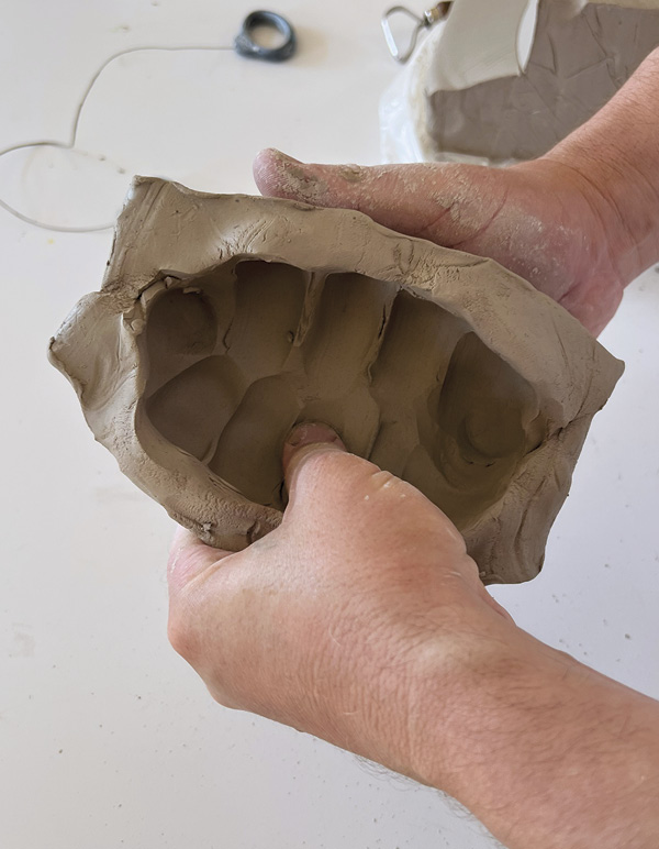 6 Stretch the block open while preserving the edges and texture of its exterior.
