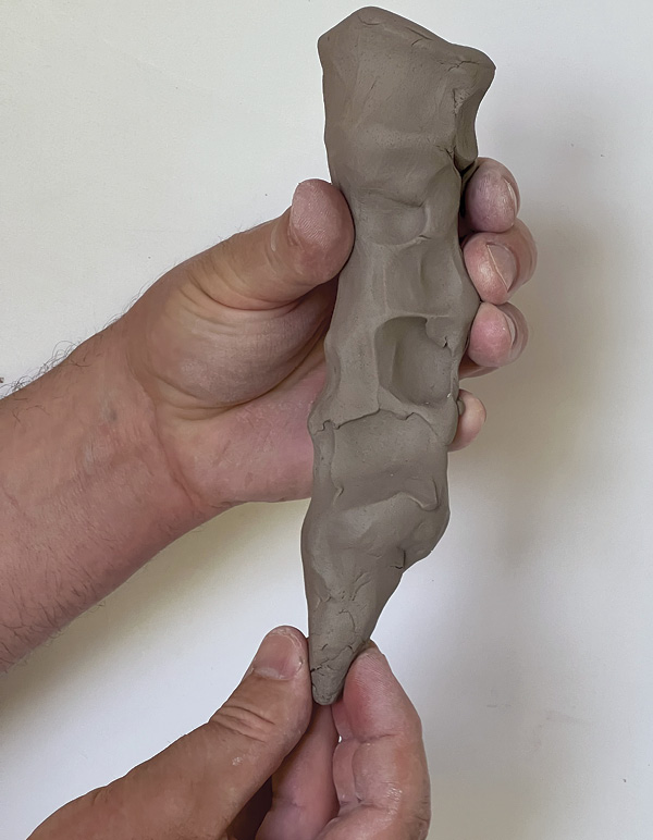 13 Form a point at the bottom of the stem for a secure attachment to the base.