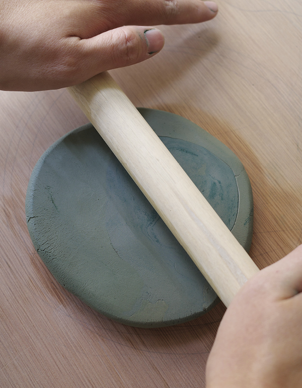 3 Roll out the colored slab, flipping it between passes with the rolling pin.