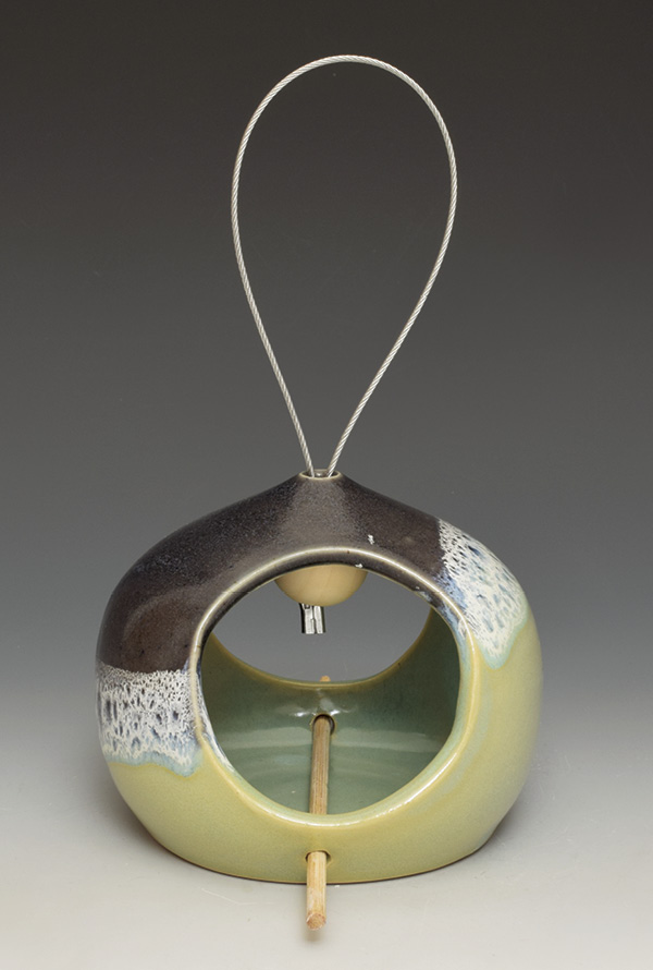 Sumi von Dassow’s dome-style bird feeder, 41/2 in. (11.4 cm) in height, wheel-thrown white stoneware, fired in oxidation to cone 6, chopstick perch.