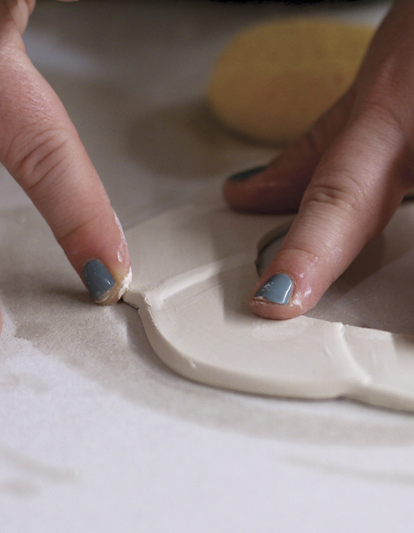 5 Flip the ring over, wet the edge, and compress it to create a tapered edge.
