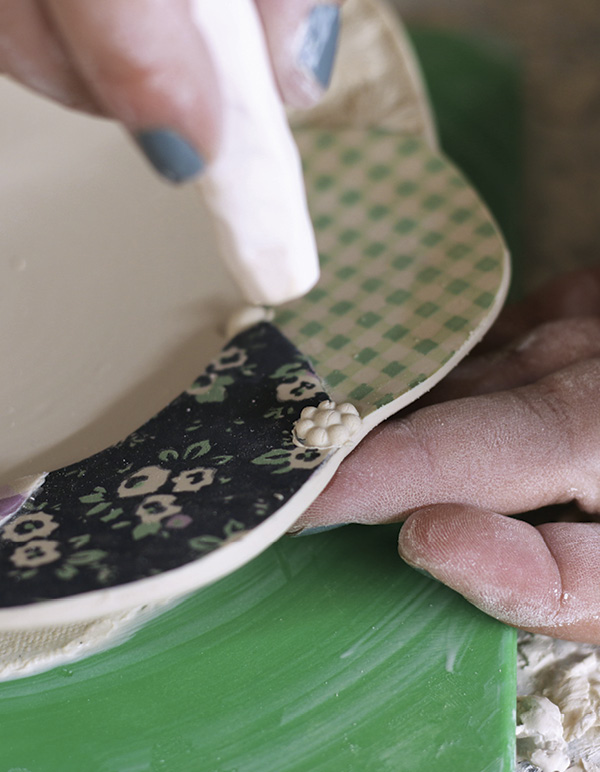 11 Reinforce the beginning and end seam with handmade decorative sprigs.