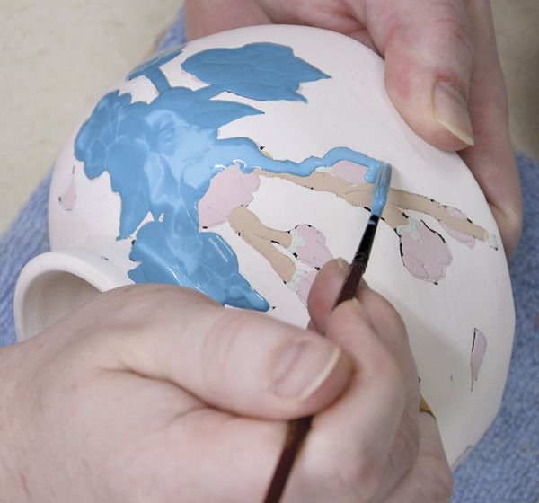 9 Apply a thick coat of latex over the foreground images and let it dry.