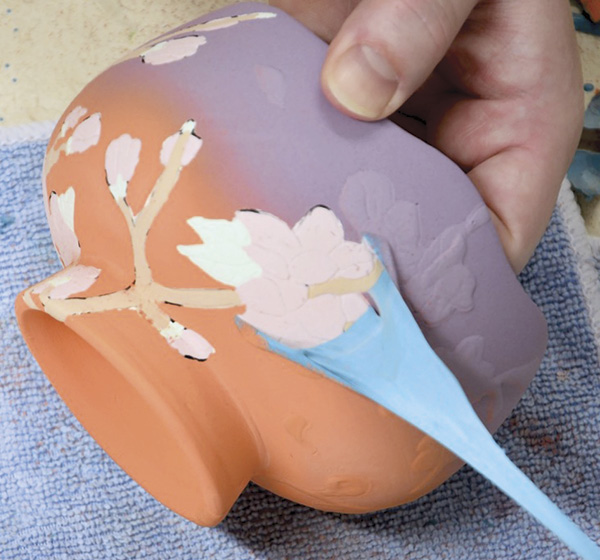 11 Remove the latex once the sprayed colors are dry.