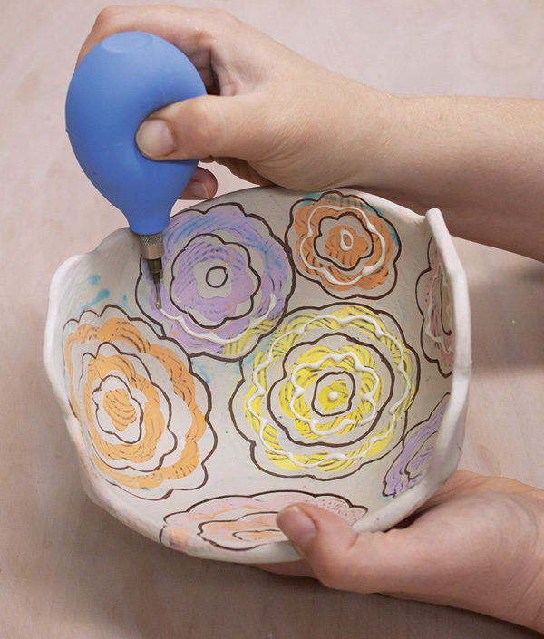 16 Add slip-trailed details to create both visual and tactile dimension to your surface design.