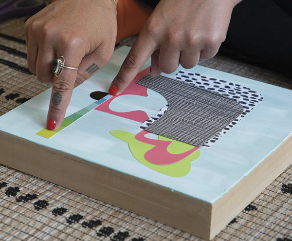 5 Adhere the paper cutouts and drawings to the painted and textured composition on the frame/canvas.