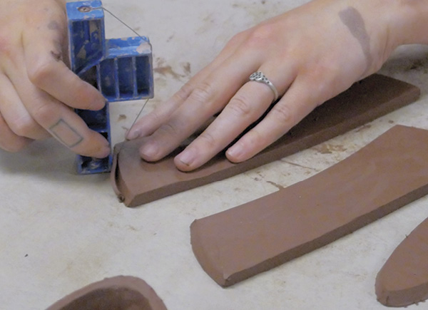 2 Use the 60° side of an angle tool to cut bevels into the slab sides  that will join to other slabs.