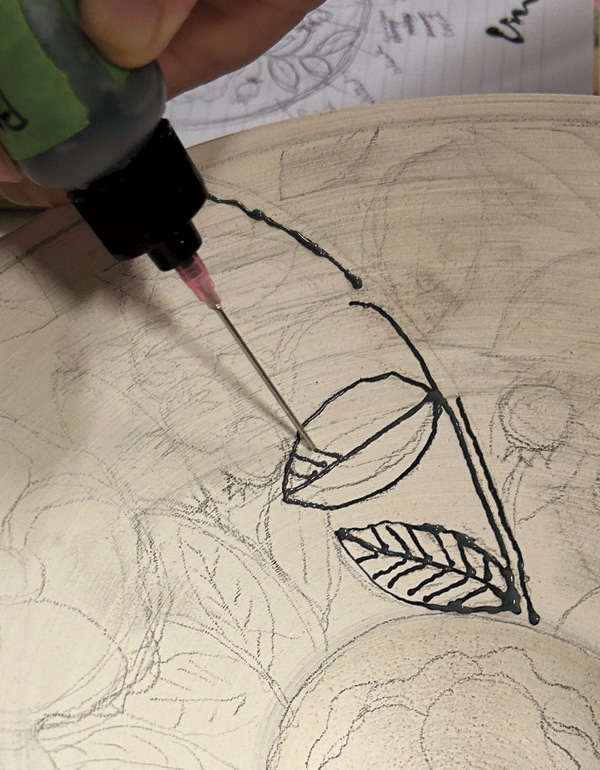 3 Use an applicator bottle with an 18-gauge tip filled with black wax resist.
