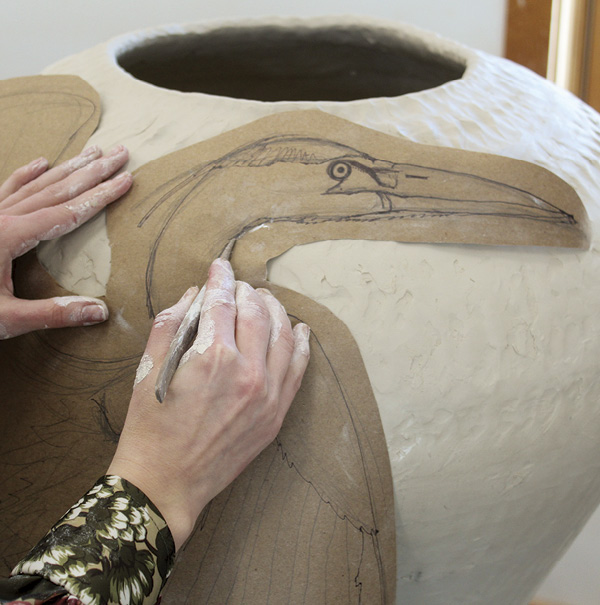 2 Cut out the drawing, then use a dull pencil to trace the image on the vessel.