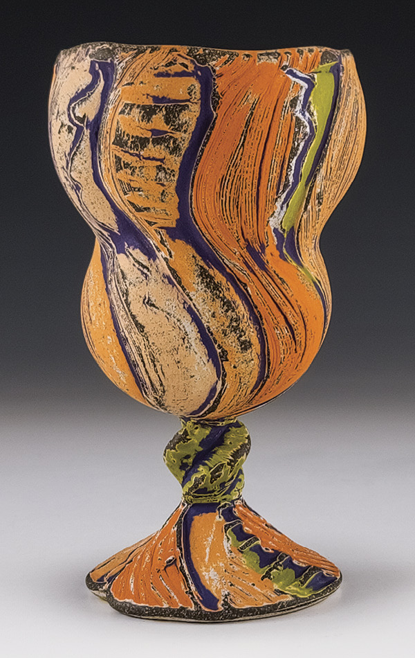 Eric Botbyl's Stemmed cup, 63/4 in. (17.2 cm) in height, thrown-and-altered dark stoneware, underglazes, glaze, fired to cone 6, 2025.