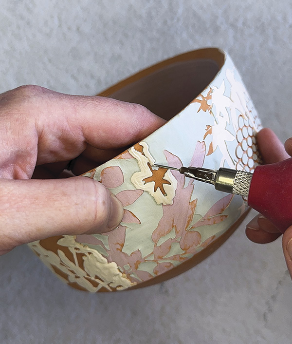 18 Use a bulb trailer with a needle nib to apply clear glaze to the slipped surfaces.