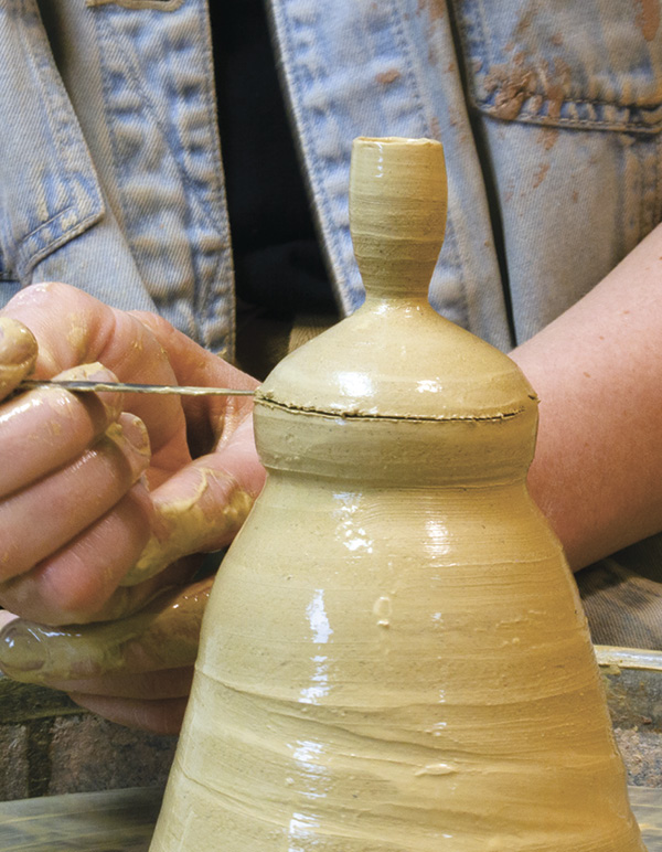 8 Cut off the neck using the same technique as the spout.