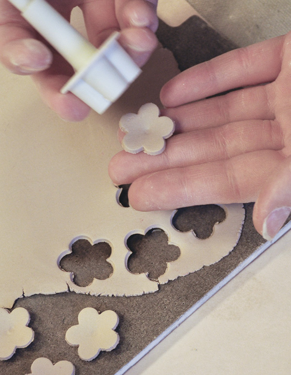 6 Cut out colored-clay flowers from a thin slab of clay.