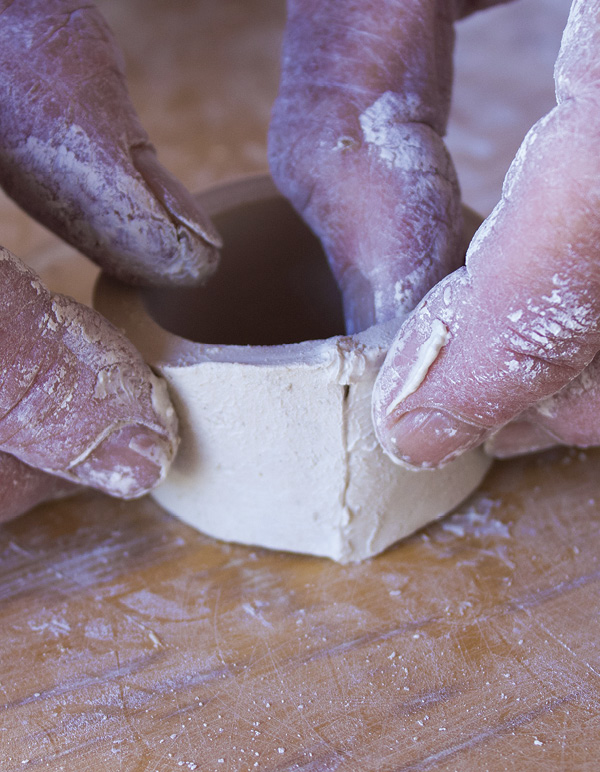 7 Cut a rectangular slab for a neck, long enough to cover the cut hole, and attach.