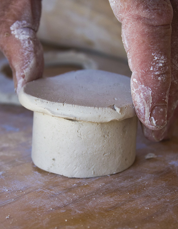 8 Cut a slab slightly larger than the neck opening and add a coil for a flange.