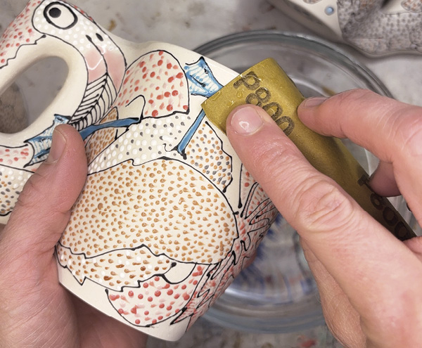 5 After the final firing, clean up any exposed porcelain with wet/dry sandpaper.