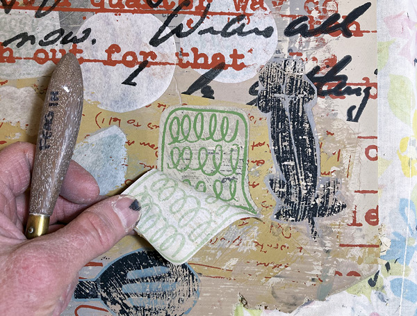 14 Carefully pull up each layer of newsprint using a sharp-tipped tool. You can see how well the floof is transferring to the clay.