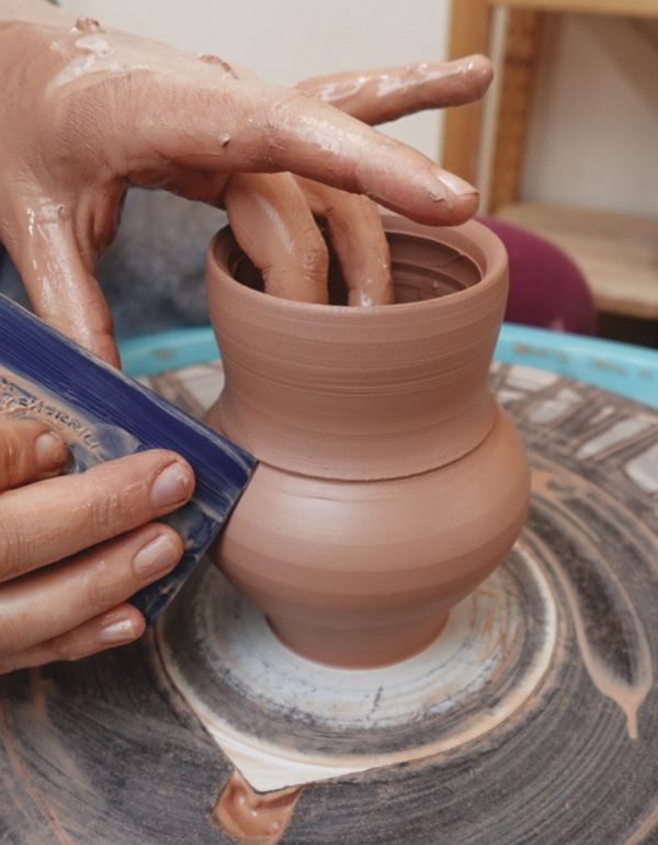 1 Throw cup. Use a square rib to create an edge in the form to carve into later.