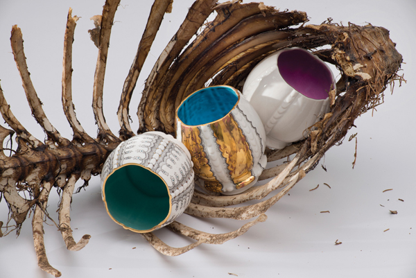  2. Meleanie Sherman’s Cups in a Baby Lamb Carcass, porcelain, glaze, overglaze, gold luster, and found objects, 2013. Photo: EG Schempf.