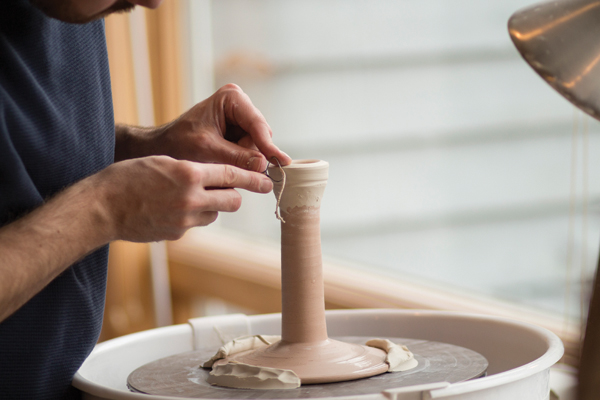 2 Center the coil with water or let it stiffen to leather hard and trim it.
