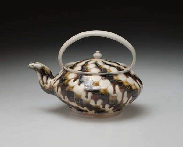 3 Teapot with bail handle, 7½ in. (20 cm) in width, porcelain, polychrome glaze, wood/oil/salt fired, 2005. Photo: Brian Oglesbee.