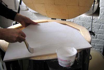 Applying kiln wash
