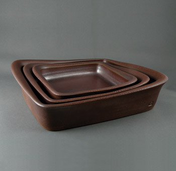 Nesting square baker/roasters, up to 12 in. (30 cm) in length, naked and glazed exterior, 2008.