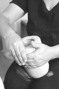 The upper walls are thinned by pushing with the thumb from the inside, while supporting the outside with the outer hand.