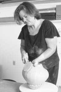 When the bottom is firm, the form is supported in a padded bowl, and paddling of the upper wall is begun.