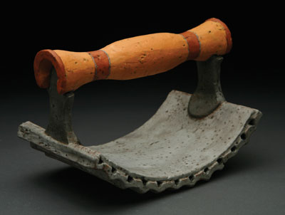 Ridged Press, 7.5 in. (19 cm) in length, handbuilt earthenware, with terra sigillata and washes, fired to cone 02 in an electric kiln, 2009.