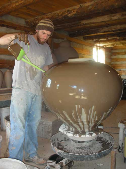Daniel Johnston using the glazing wheel.